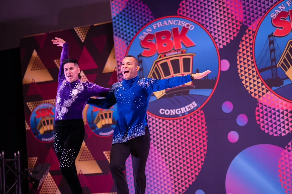 Takeshi Young performing a salsa duet at the San Francisco SBK Congress